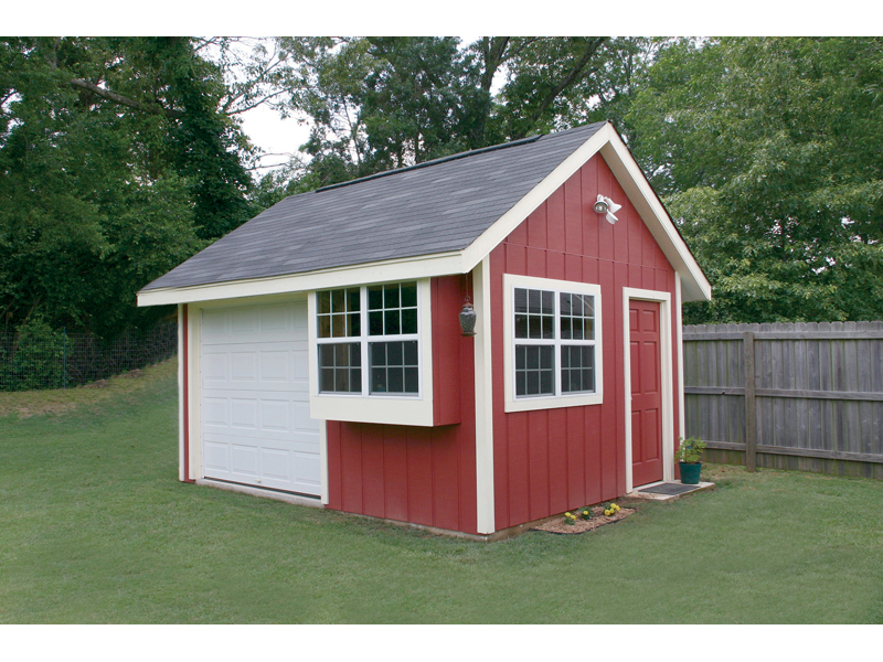 This convenience shed has multiple windows for added light, a side door and front garage style door