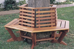 Rustic wood tree seat wraps around trunk