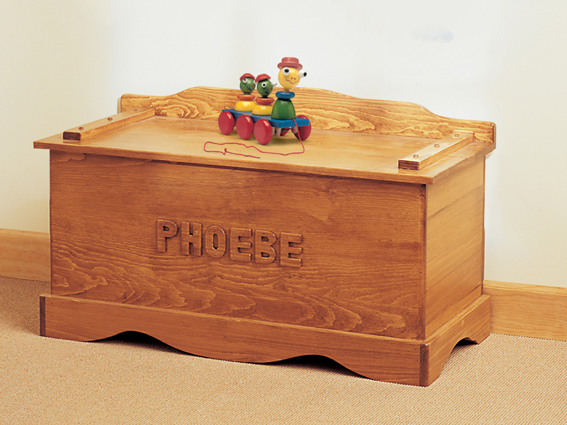 Old-fashioned wood toy chest includes a place for personalizing 