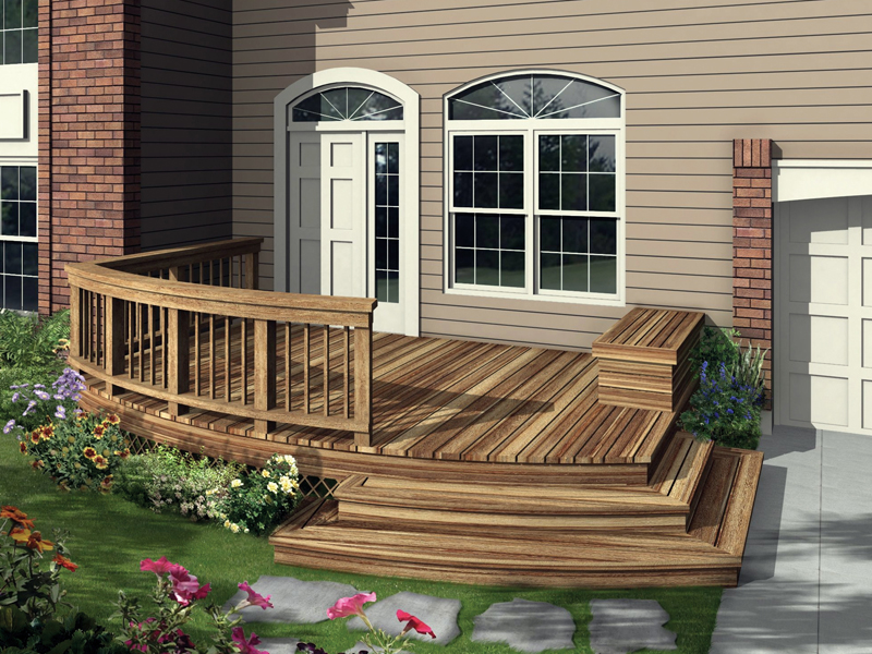 Low-level deck has a portion with a railing and shallow steps to the ground level